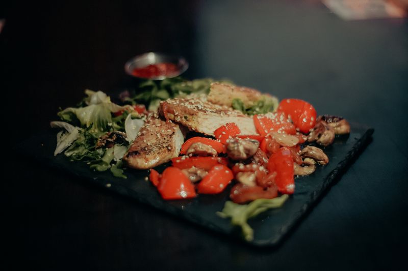 Grilled portobello mushroom steak with roasted peppers