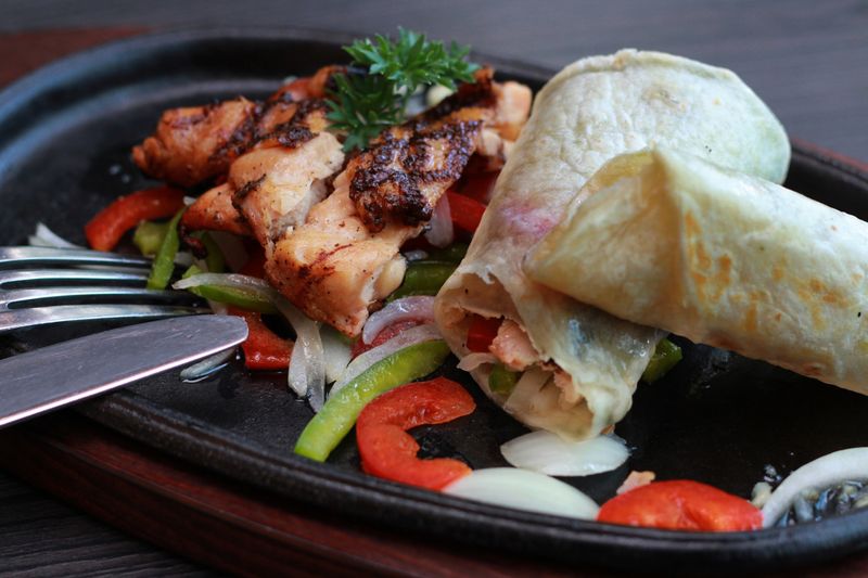 Grilled chicken wrap with fresh vegetables and yogurt sauce